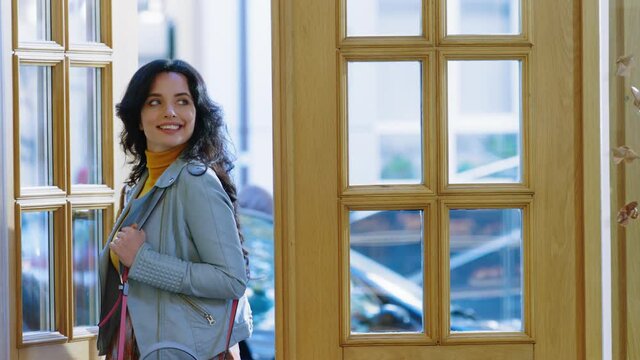 In the coffee shop enter a beautiful attractive woman customer she walking in front of the camera and feeling excited. 4K