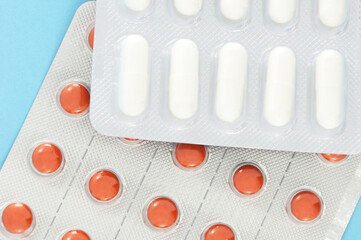 Blister of  white and orange pills closeup. Pharmacy