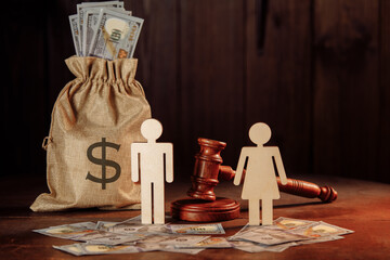 Bag of money, dollar banknotes, people and the judge's hammer. The concept of divorce