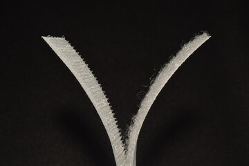Velcro tape isolated on black background.