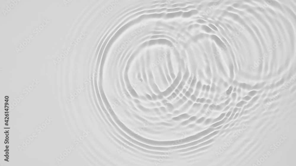 Poster Up close, top view, Slow motion various waves of the water surface hitting the sun's rays, making them sparkle according to different patterns on a gray background video 4K.