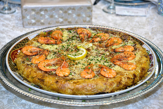 Bastila or `Pastilla` is a traditional moroccan dish. fish Bastila is a pie filled with fish's , eggs,onions, sugar. In some regions of Morocco, it is typically made with pigeon meat or fish.