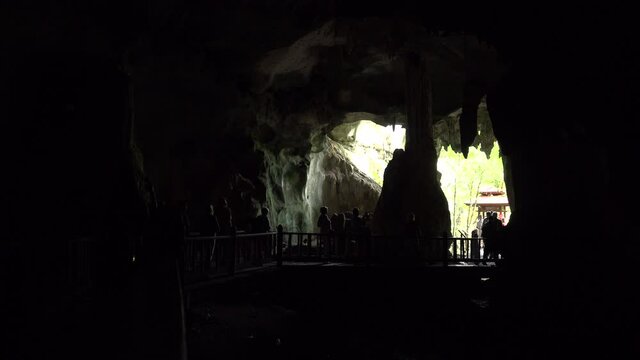 entrance of the bats cave in malaysia wuth light coming in.