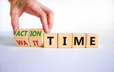 Action or wait time symbol. Businessman turns wooden cubes and changes words wait time to action time. Beautiful white background, copy space. Business and action or wait time concept.