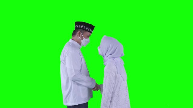 Muslim woman apologizing to her husband on studio