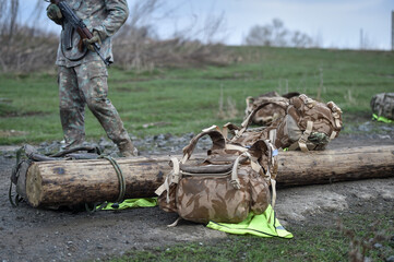 Special forces military training. Photograph detail with military equipment and assault rifle.