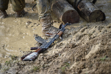 Special forces military training. Photograph detail with military equipment and assault rifle.
