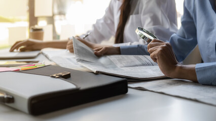 Young unemployed is searching for a job in the newspaper and laptop. Interview the job and hiring...