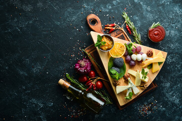 Assorted cheese. Set of cheese, nuts and grapes. Top view. Free copy space.