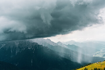 Rain wall and downpour in the Sexten Dolomites, Italy.