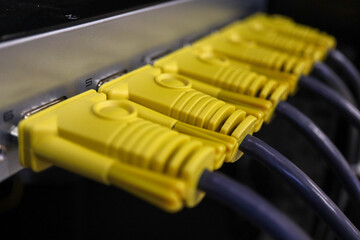 yellow computer video VGA cables on KVM panel close up