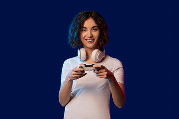 happy curly involved gamer girl playing video games
