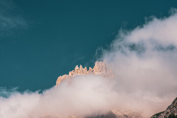 Clouds over mountain peaks in the Dolomites, Italy.
