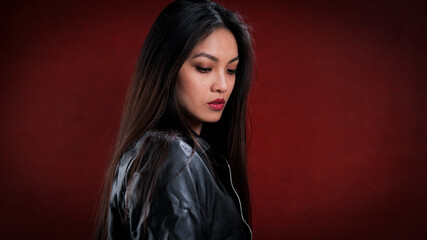 Fototapeta premium Young Asian woman in profile - studio photography