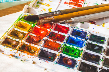 watercolor paints and brushes