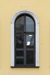 Windows on old city facades, with decorative elements