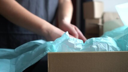 Worker packs cosmetic products. Delivery of cosmetics. Online shopping