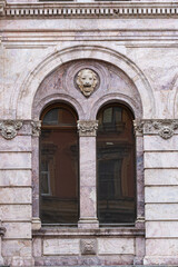 Windows on old city facades, with decorative elements