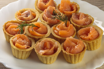 Tasty tartlets with salted salmon. - obrazy, fototapety, plakaty