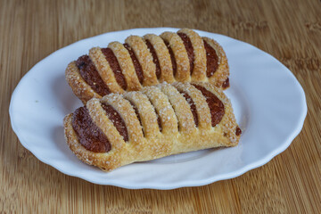 Tasty cookies with apple jam closeup.