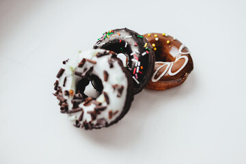 Delicious colorful donuts with different flavors on the background