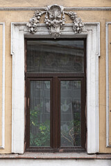 Windows on old city facades, with decorative elements