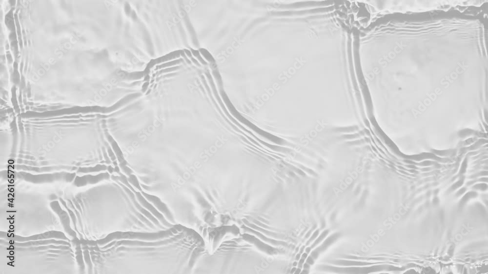Poster up close, top view, slow motion various waves of the water surface hitting the sun's rays, making th