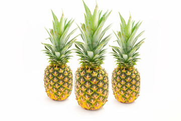 Three whole pineapple isolated on white background