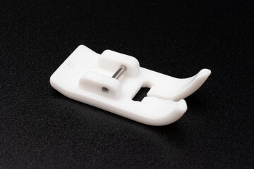 Non stick foot for electronic portable sewing machine