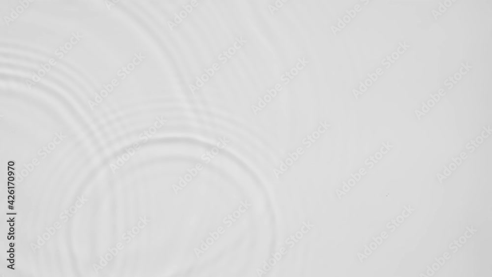 Poster up close, top view, slow motion various waves of the water surface hitting the sun's rays, making th