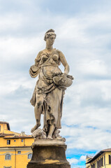 Florence, Statue sculpture at Ponte alla Carraia medieval Bridge landmark on Arno river.