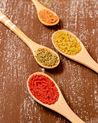 spices in wooden spoons