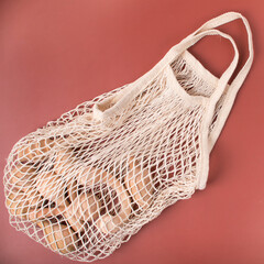 wooden toys in a string bag