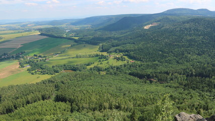 A view to the landscape with fields and forests from the lookout place Koruna near Broumov, Czech republic