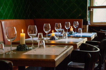 Wine glasses in a row. Restaurant table celebration of wine tasting with candles burning....