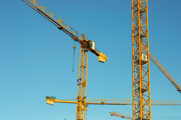 construction site with tall yellow crane
