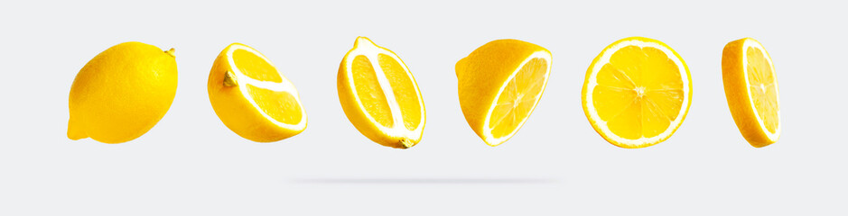 Juicy ripe flying yellow lemons on light gray background. Creative food concept. Tropical organic...