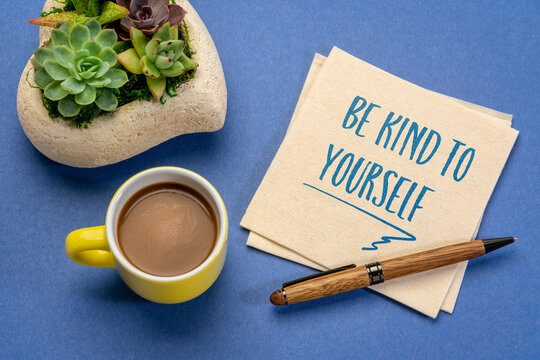 be kind to yourself - inspirational handwriting on a napkin with a cup of coffee, self care concept