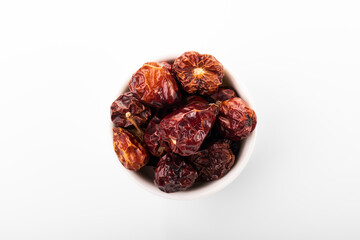 Dry red chili pepper. Dry red chili pepper in white bowl, on white background. small chili pepper