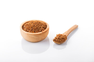 Ras el hanout moroccan spice. Ras el hanout in wooden bowl, on white background. Moroccan spice