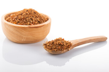 Ras el hanout moroccan spice. Ras el hanout in wooden bowl, on white background. Moroccan spice