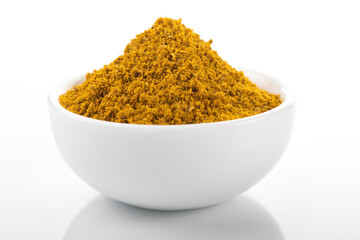 Ras el hanout moroccan spice powder. Ras el hanout in white bowl, on white background. Moroccan spice