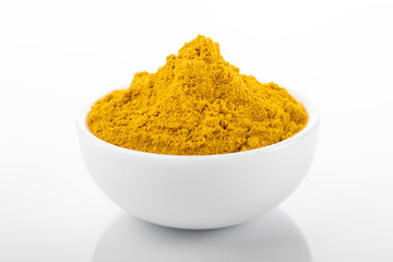 Curry powder. Curry powder in white bowl, on white background. Curry