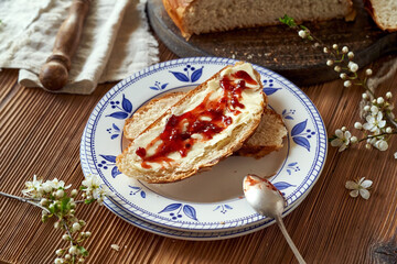 Sliced mazanec, traditional Czech sweet Easter pastry, similar to hot cross bun, with blooming branches