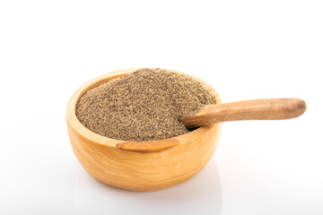 Black pepper. Black pepper in wooden bowl, on white background. Black pepper powder.