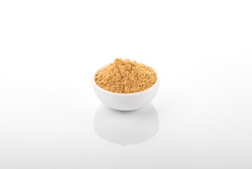 Ginger powder. Ginger powder in white bowl, on white background. Ginger, ginger powder.