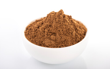 Cinnamon, cinnamon powder. Cinnamon powder in white bowl, on white background. 