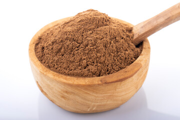Cinnamon, cinnamon powder. Cinnamon powder in wooden bowl, on white background. 