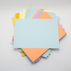 a stack of colored paper with a place for text