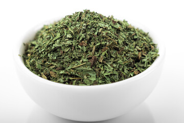 Dry mint. Dry mint in white bowl, on white background. Mint.